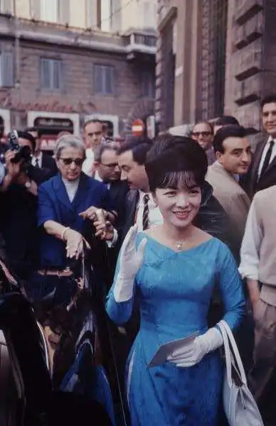 Ms. Trần Lệ Xuân in her boat neck design of ‘ao dai’