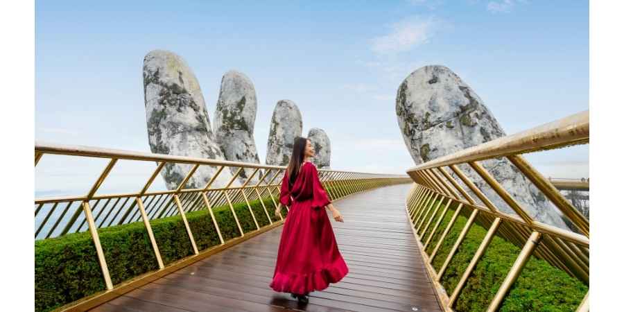 Marvel at the stunning design of the Golden Bridge symbolizing natures embrace and human creativity 11zon Unique things to do in Vietnam