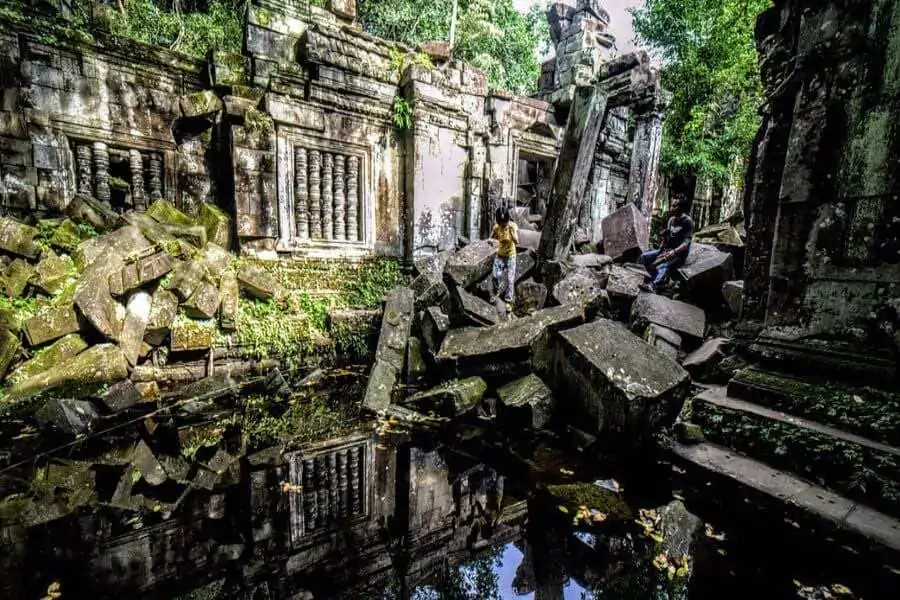 Beng Mealea temple is an extensive ruin overrun by vines and tree roots.